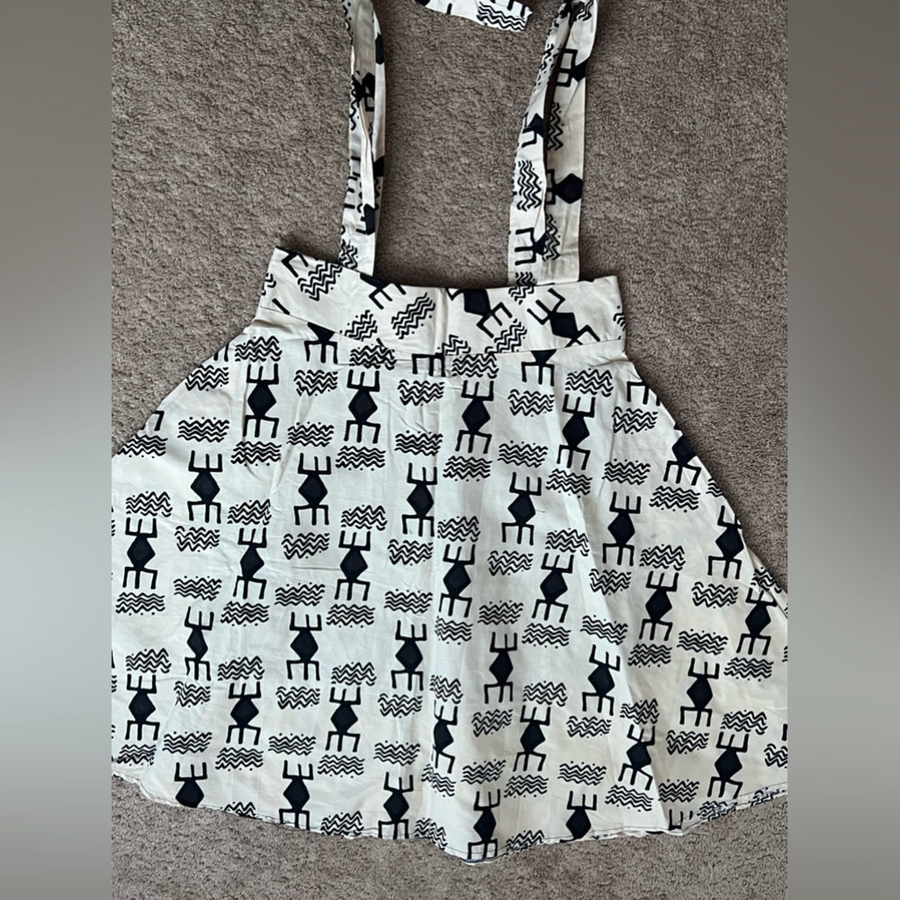 Womens Pinafore Cotton skirts with pockets on the side and back zip opening.